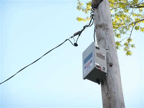 electrical box on telephone pole|town's utility pole boxes.